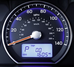 Speedometer in parked car, with LCD display of odometer and trip calculator